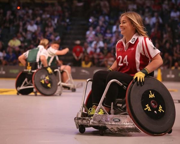 How do adaptive sports empower individuals with disabilities?